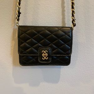Small black and gold satchel